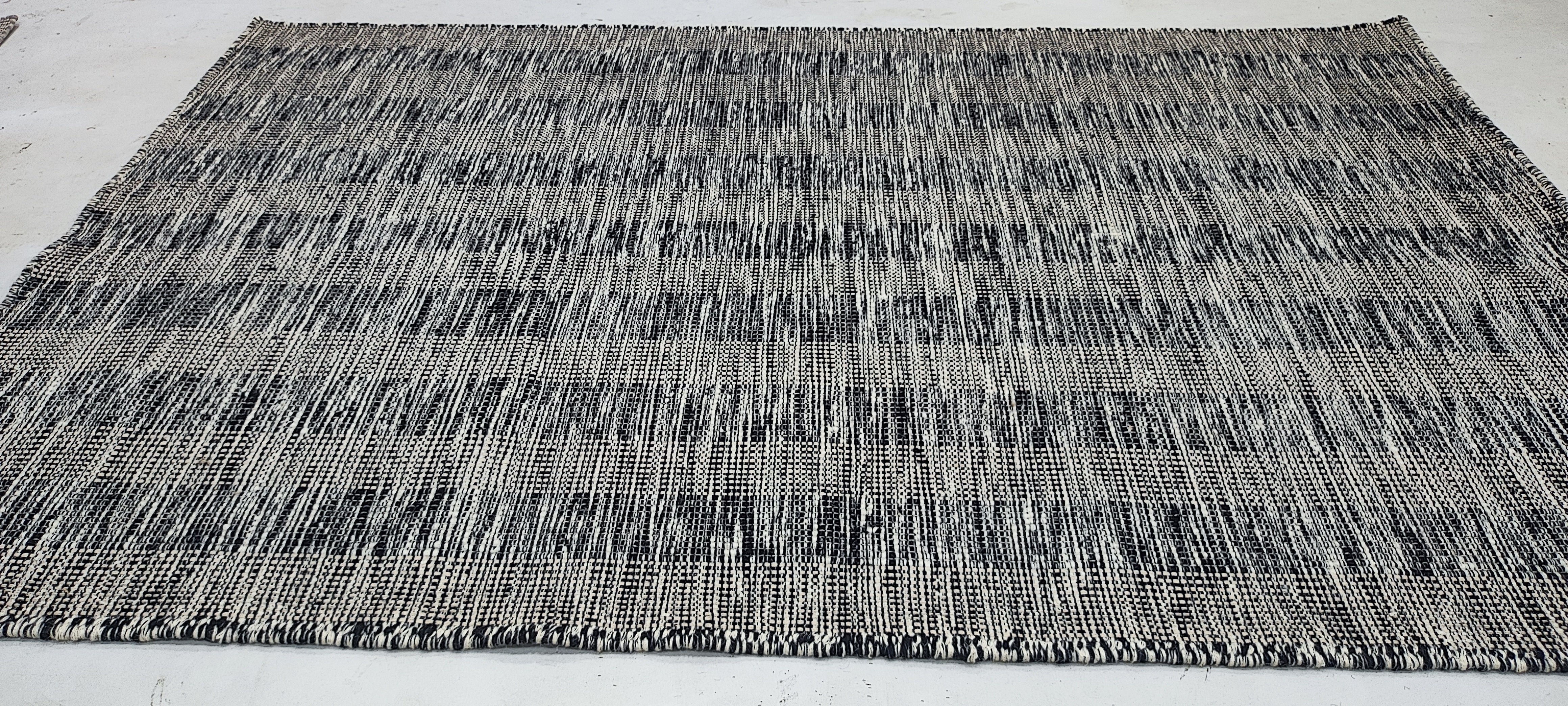 Reggie Franklin 5.3x8 Handwoven Durrie Rug Ivory and Black