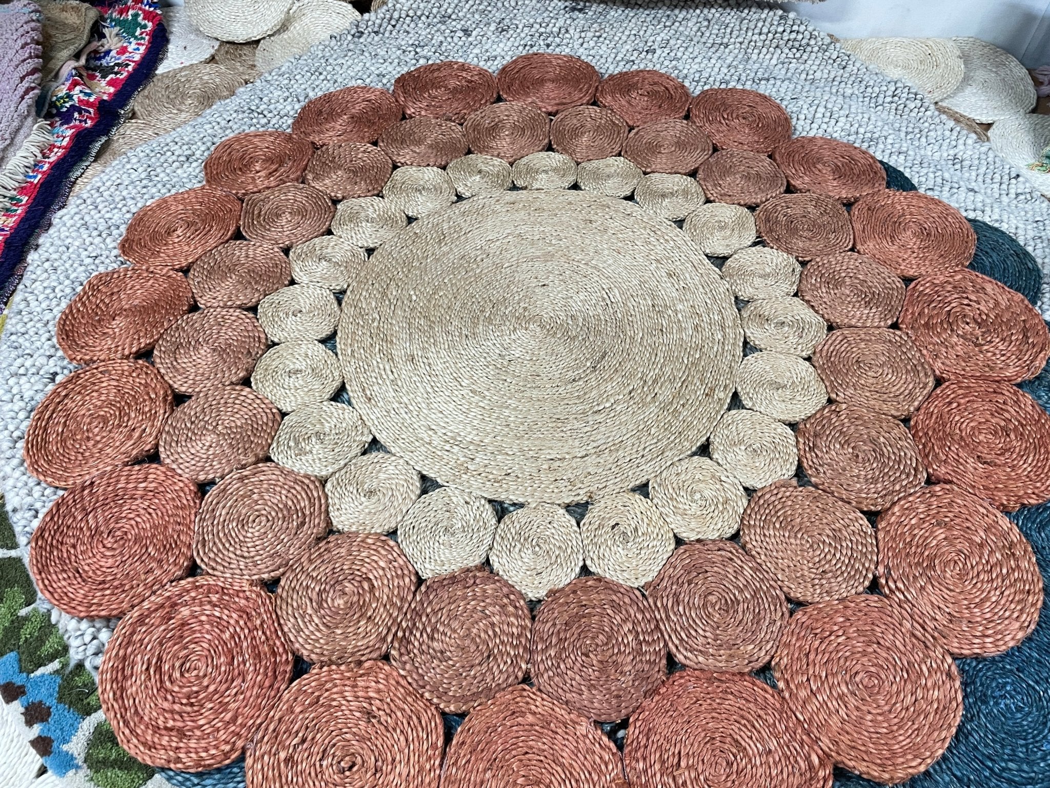 http://bananamanor.com/cdn/shop/products/areola-51-handwoven-beige-and-copper-5x5-round-rug-346269.jpg?v=1683155776