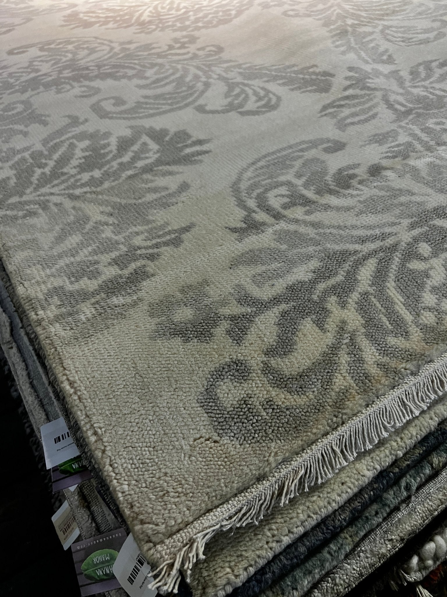 http://bananamanor.com/cdn/shop/products/cosmina-5x8-ivory-and-grey-hand-knotted-modern-rug-732679.jpg?v=1683156887