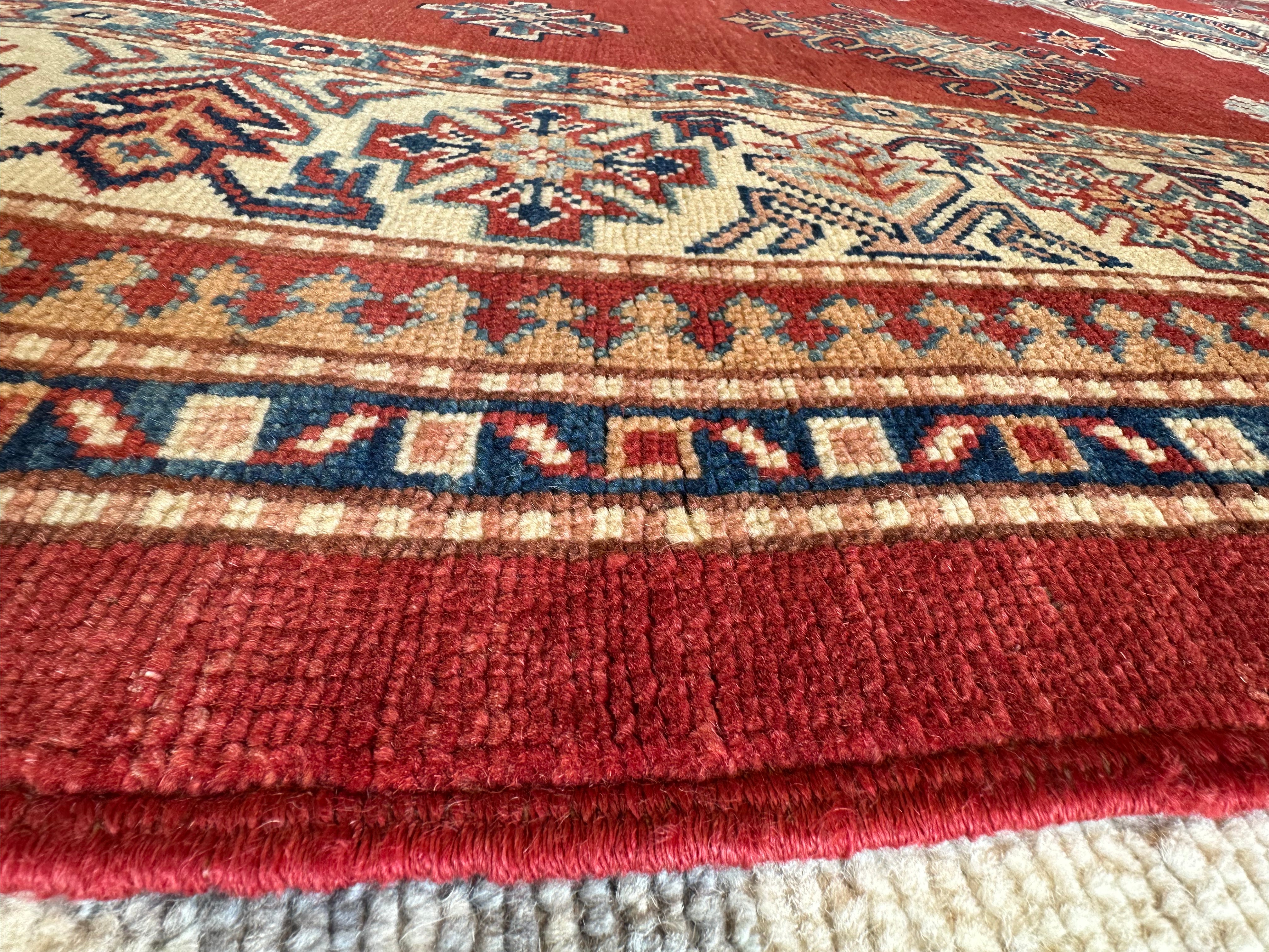 Katie Walsh 6.1x9.3 Red Hand-Knotted Kazak Rug