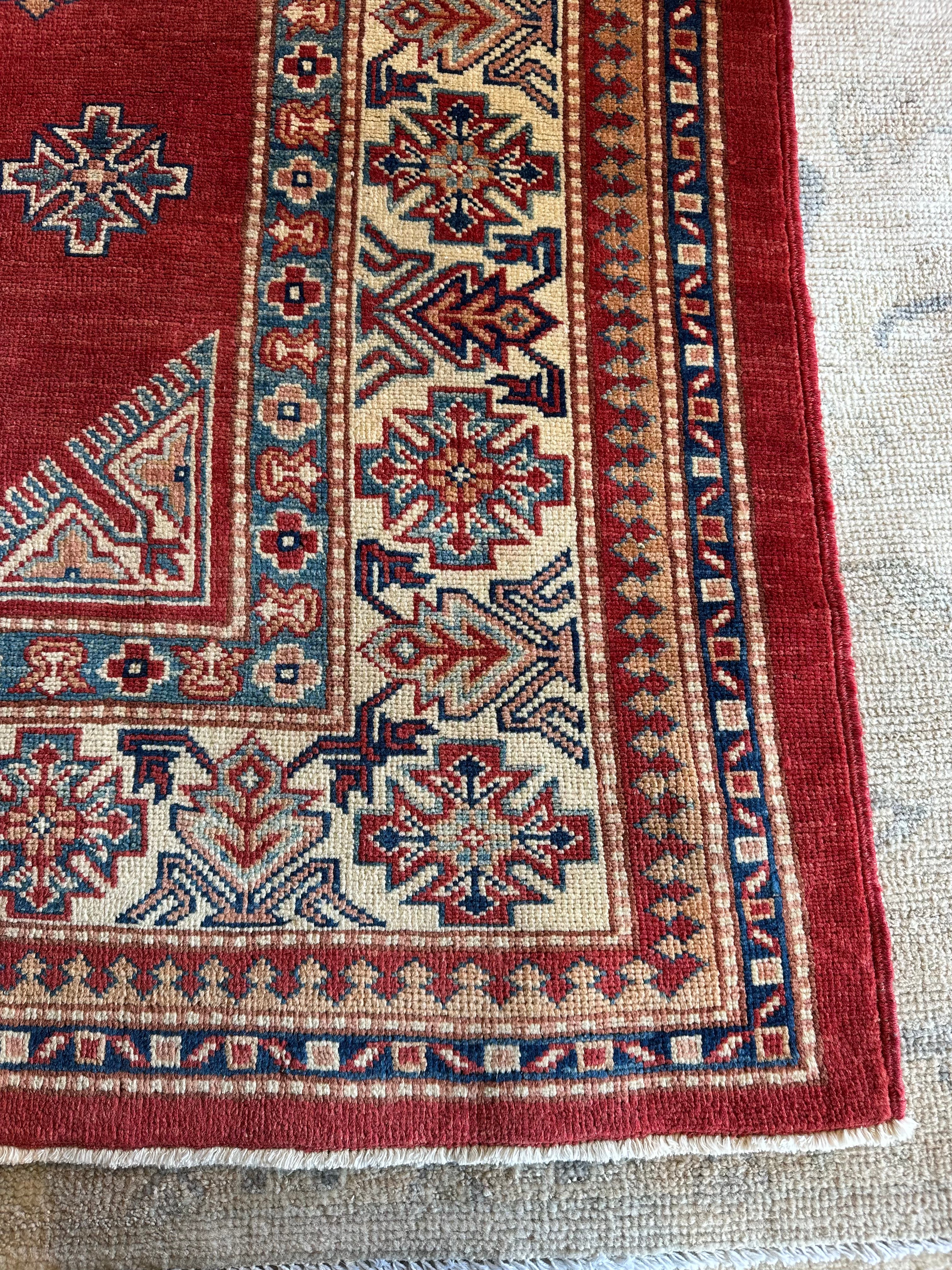 Katie Walsh 6.1x9.3 Red Hand-Knotted Kazak Rug