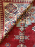 Katie Walsh 6.1x9.3 Red Hand-Knotted Kazak Rug