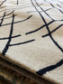 Quintron 5x8 Hand-Tufted Ivory & Black High Low
