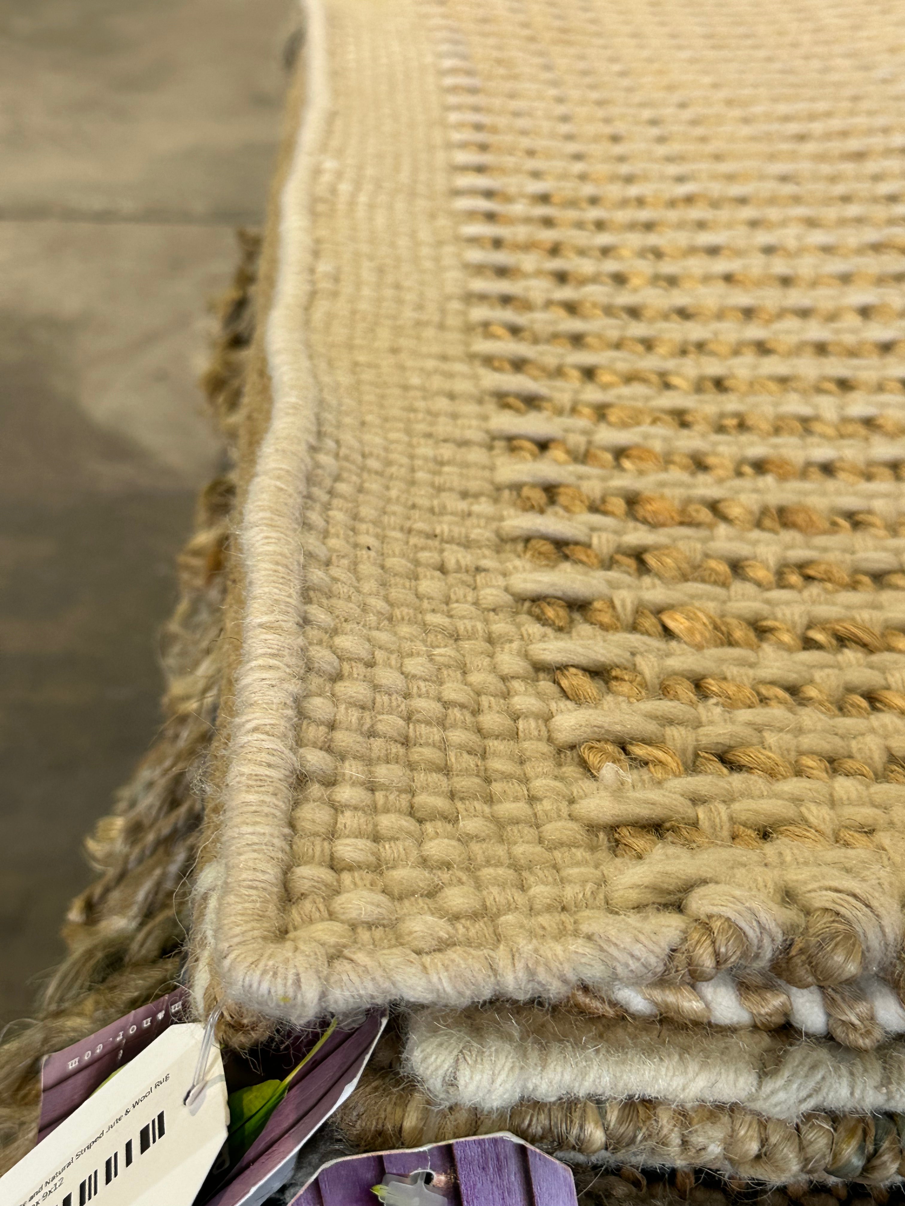 Uzoma Nwachukwu 9.3x12 Cream Handwoven Modern Rug