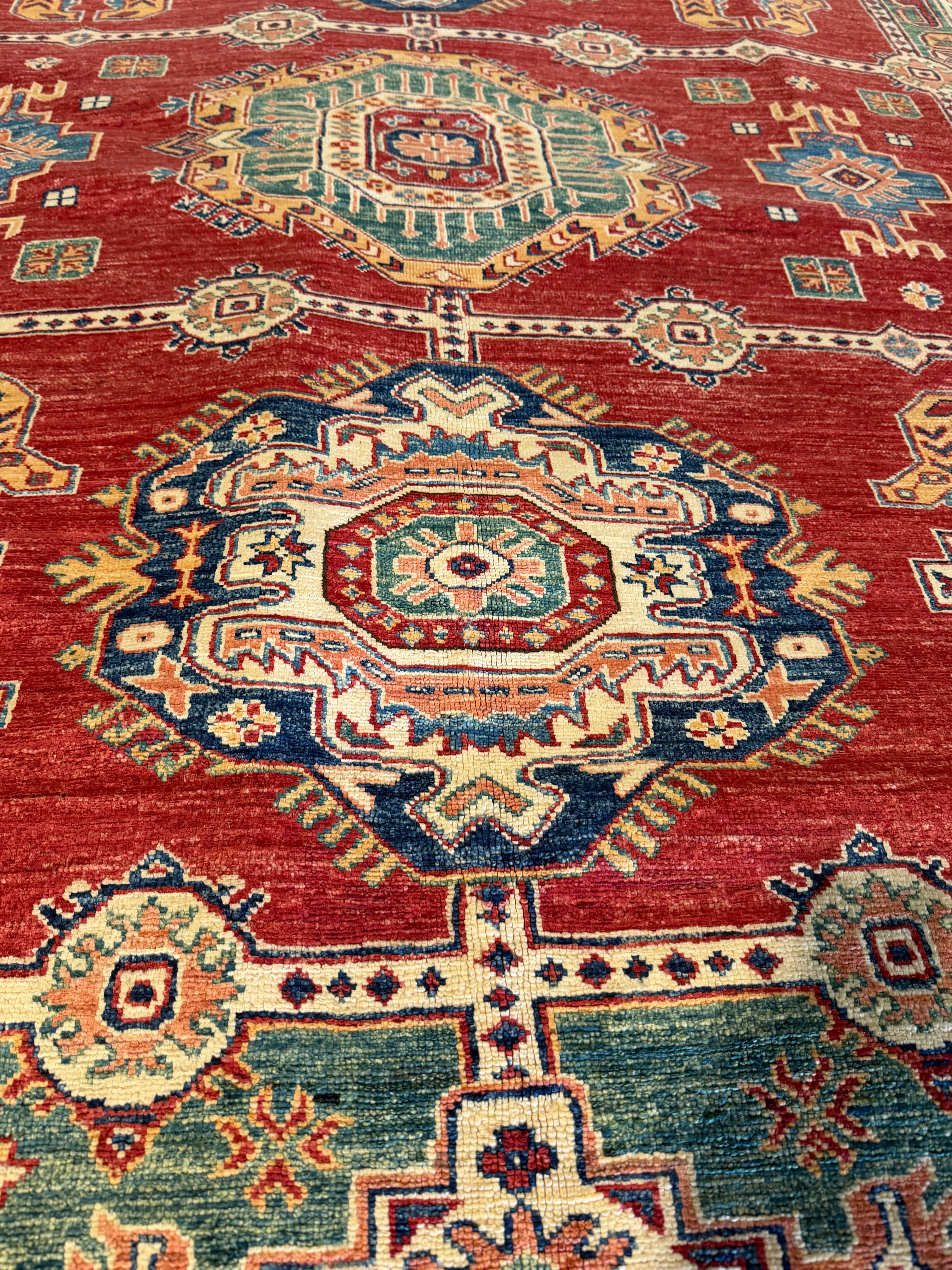 Theresa Thompson 7.11x10.2 Red and Green Afghani Kazak Rug