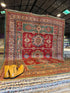 Theresa Thompson 7.11x10.2 Red and Green Afghani Kazak Rug