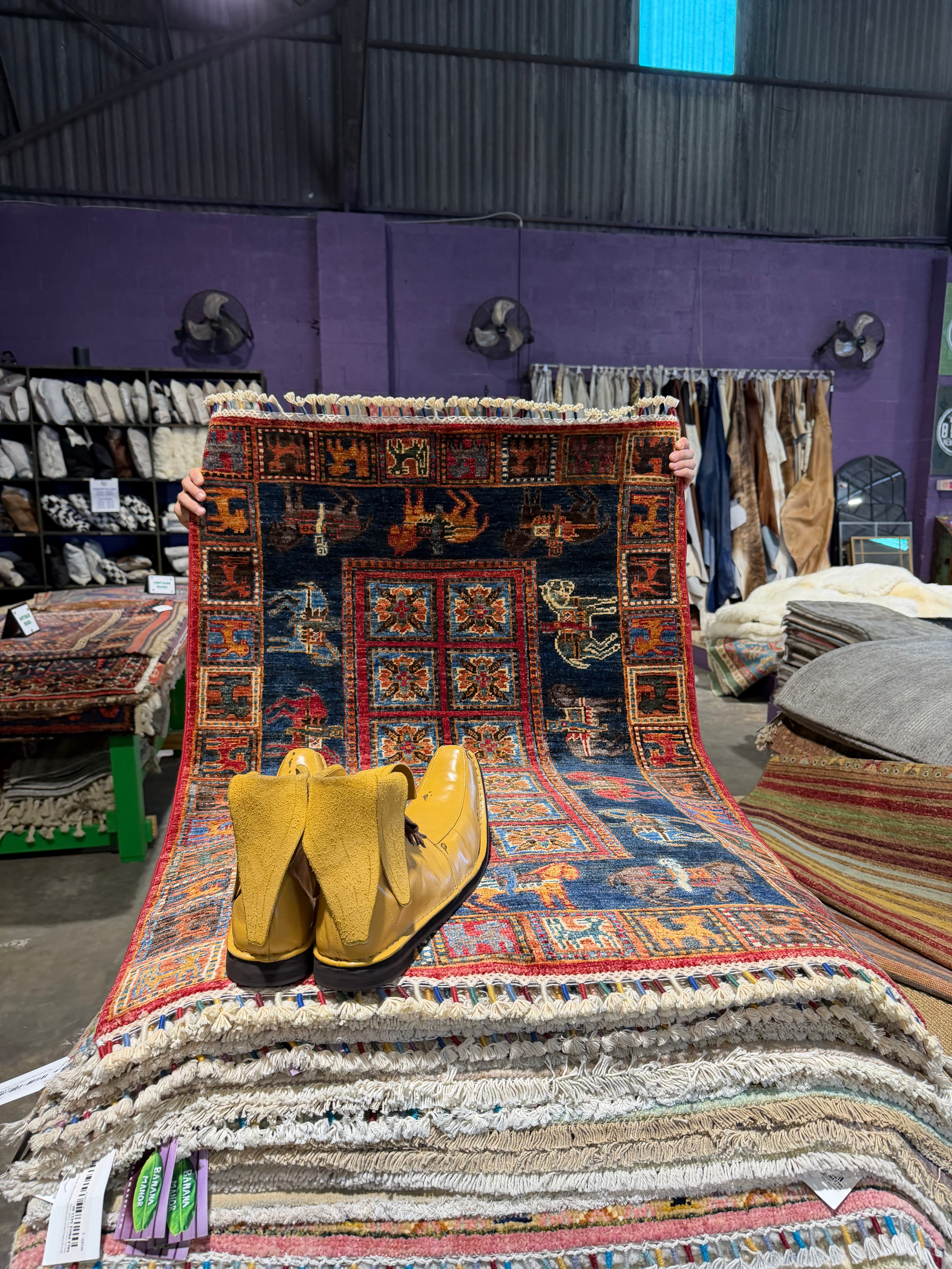 Kristen Maxwell 2.11x4.2 Red Afghani Animal Rug