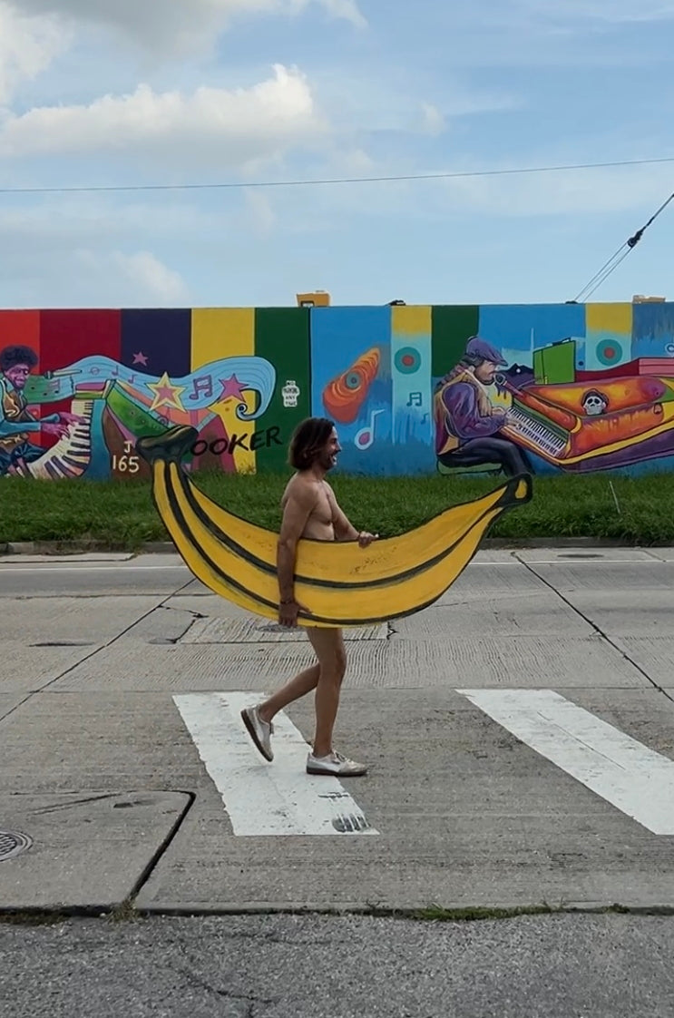 Naked Banana Manor guy crossing street