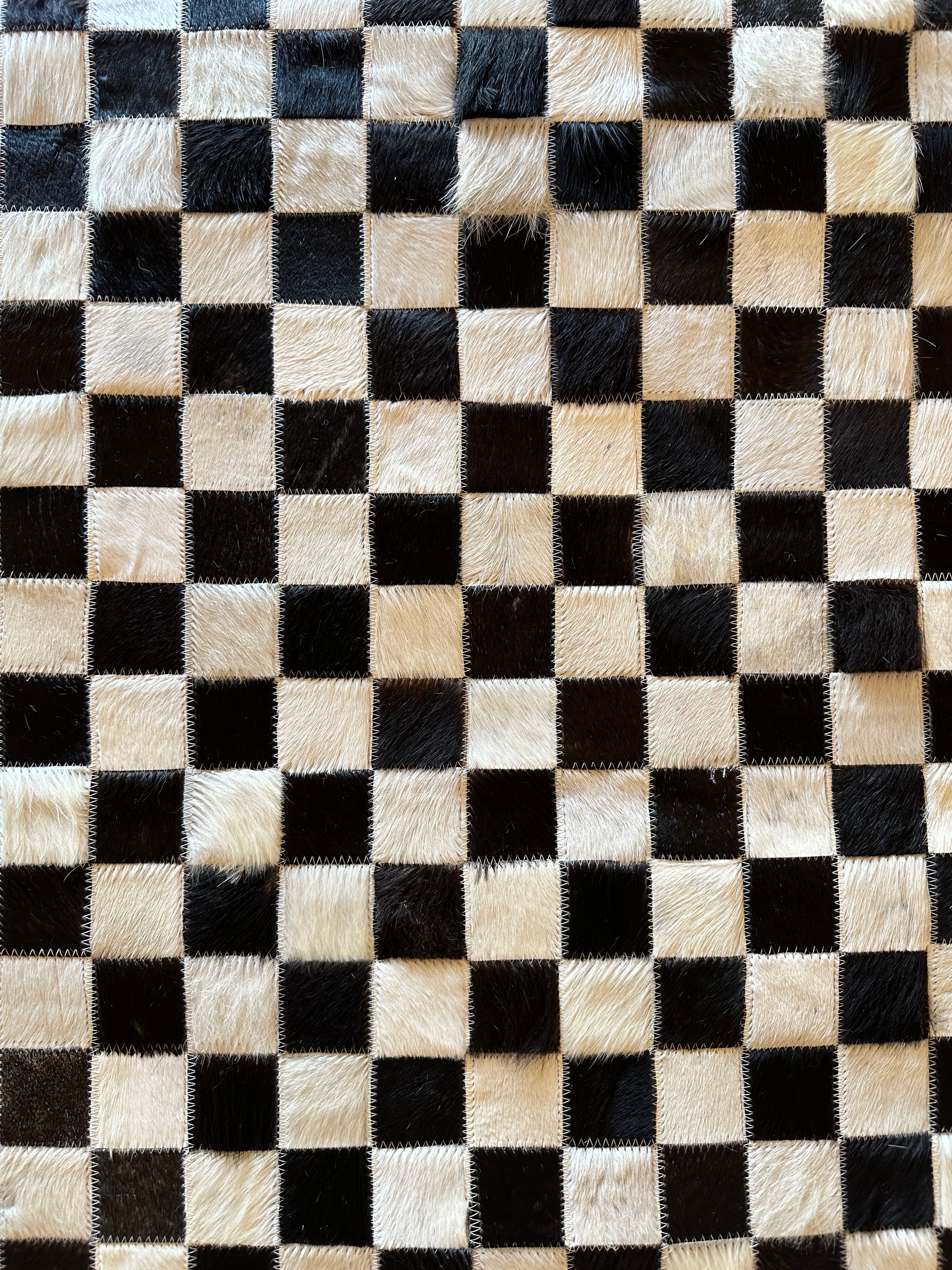 Tomahawk 2.3x7.10 Black and White Checkerboard Cowhide Runner