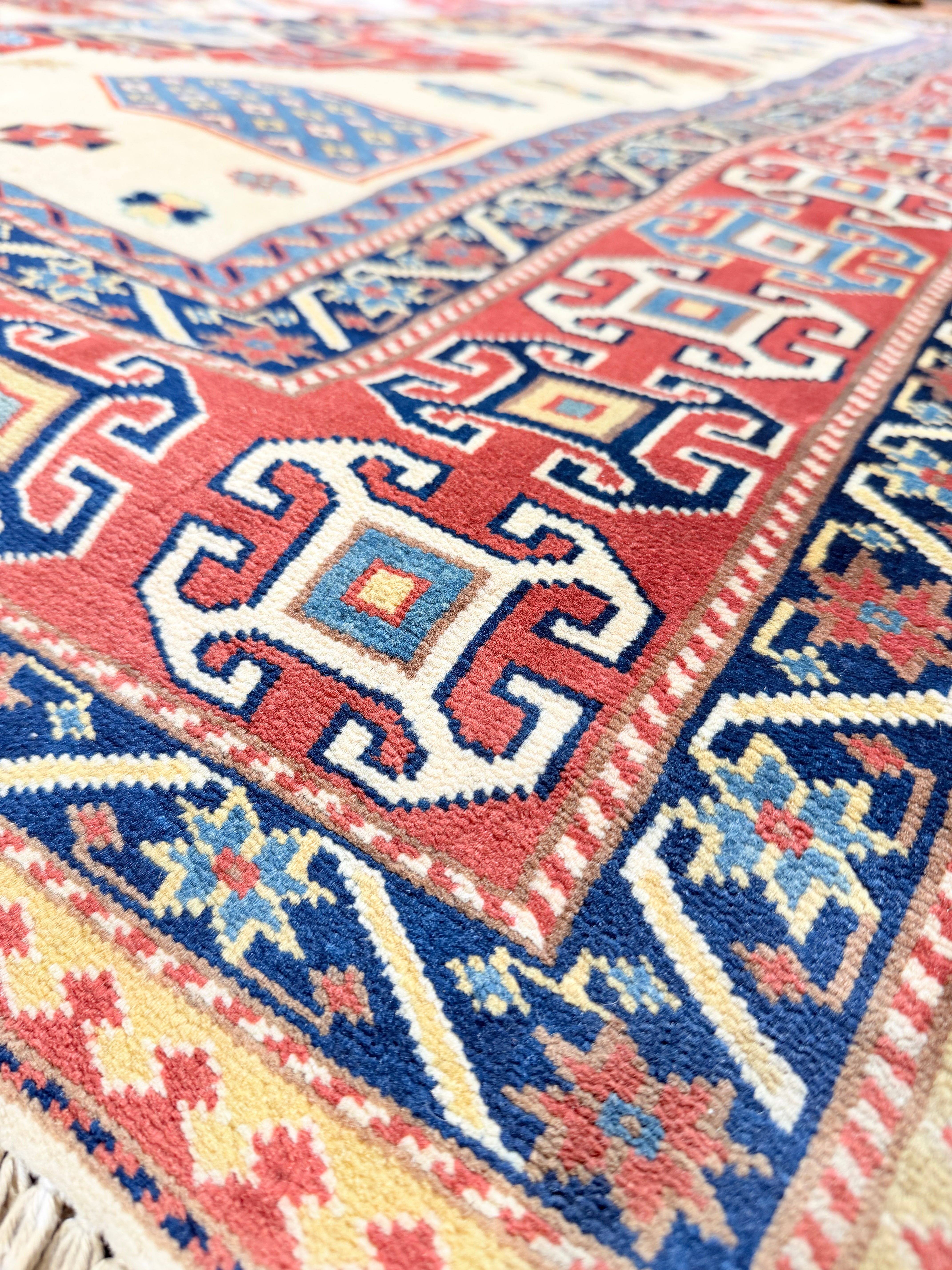 Caitlin Schneiderhan 5.4x7 Afghani Kazak Red Rug