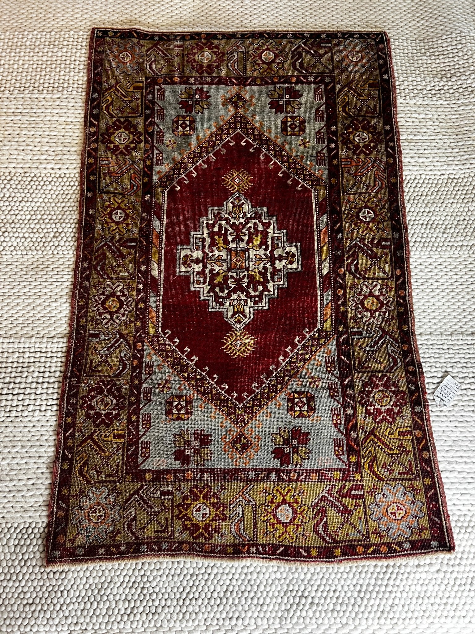 https://bananamanor.com/cdn/shop/products/arzu-36x59-turkish-vintage-oushak-red-and-grey-rug-434752.jpg?v=1702725667