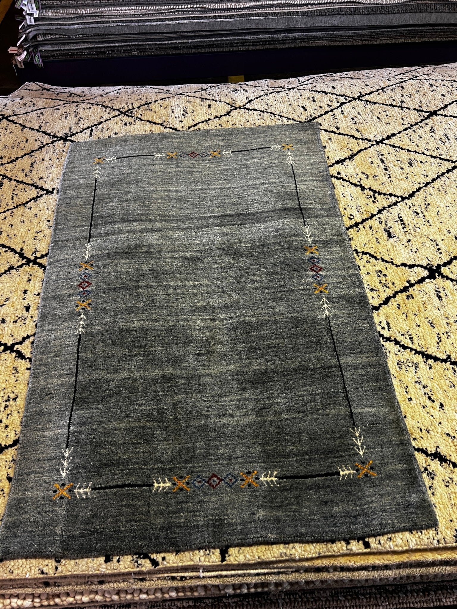 https://bananamanor.com/cdn/shop/products/barsten-3x49-grey-handwoven-gabbeh-rug-841692.jpg?v=1697062386