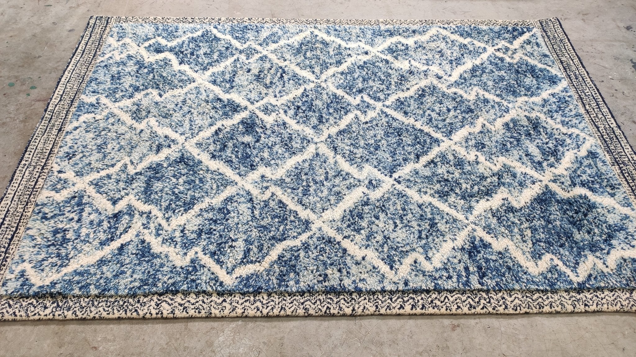 https://bananamanor.com/cdn/shop/products/iben-hjejle-5x76-blue-hand-tufted-rug-738587.jpg?v=1689356444