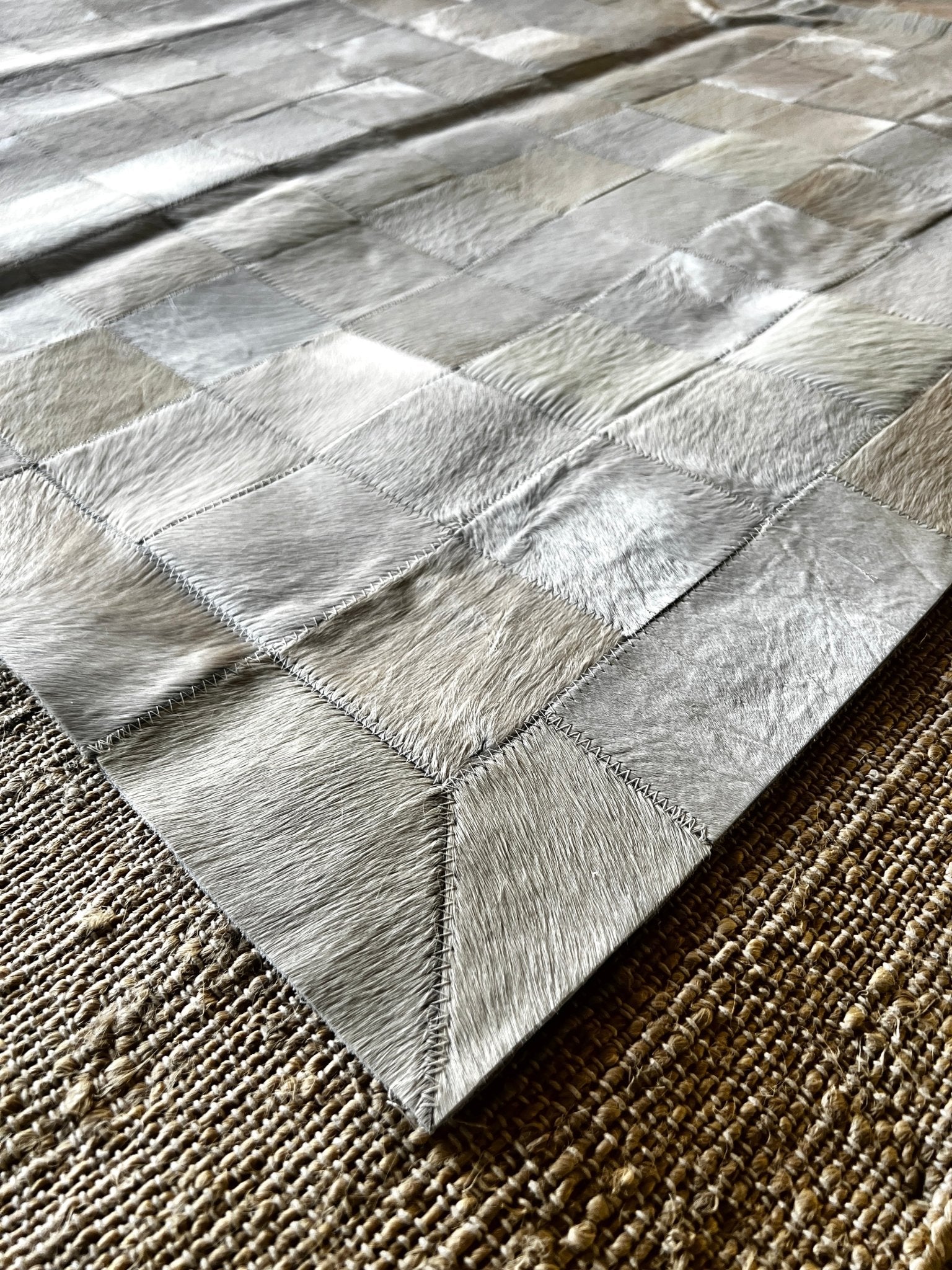 Off White and Tan Patched Cowhide 6.7x9.2 Rug With Border | Banana Manor Rug Company