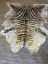 Zebra Print Cowhide With Gold Accents | Banana Manor Rug Company
