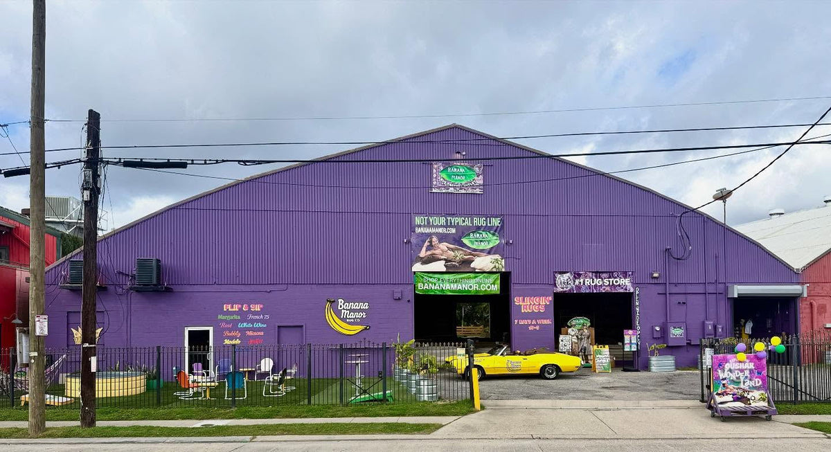 The purple Banana Manor Rug Factory Outlet warehouse on Tchoupitoulas Street